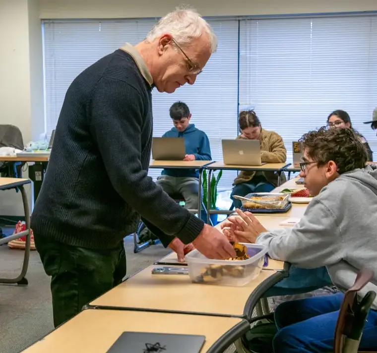 Teacher Bruce Finkelstein teaching Student in Class