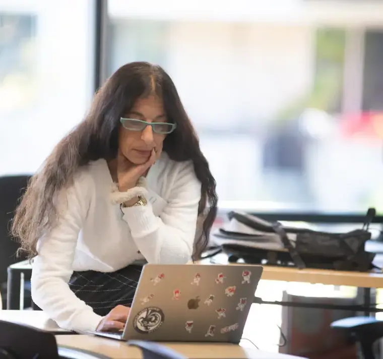 Faculty Typing on Computer