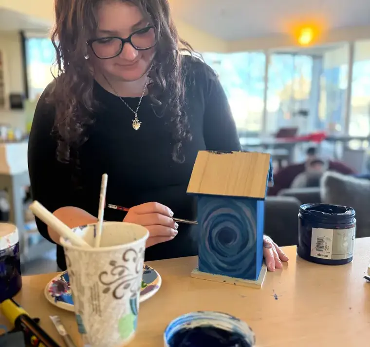 Student Making and Painting Ceramics