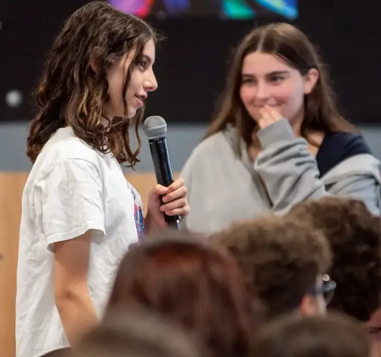 Students Doing Presentation with Microphones
