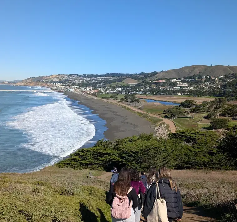 Students Walking and Looking out Over Beach