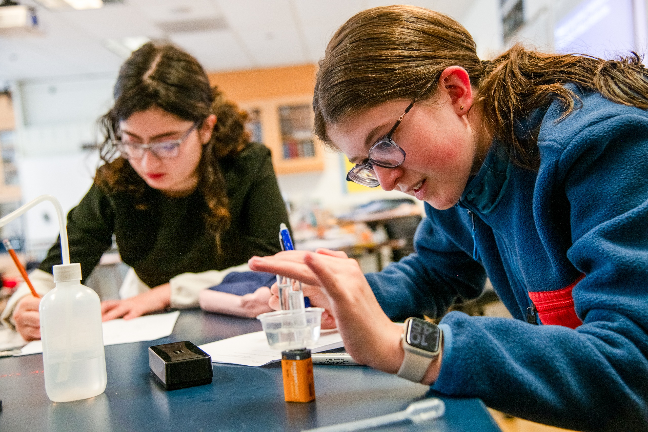 Students Natetaking and Doing Experiments